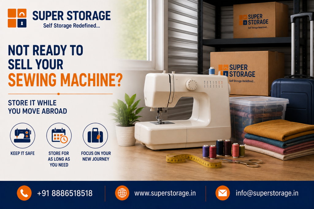 A promotional banner for Super Storage targeting international movers, featuring a white electric sewing machine on a wooden table alongside thread spools, scissors, a measuring tape, folded fabric, and a plastic container filled with textiles, set next to Super Storage cardboard boxes, a dark blue suitcase, and metal shelving, accompanied by the headline "Not Ready To Sell Your Sewing Machine? Store It While You Move Abroad", service icons for "Keep It Safe", "Store For As Long As You Need", and "Focus On Your New Journey", with contact details at the bottom.