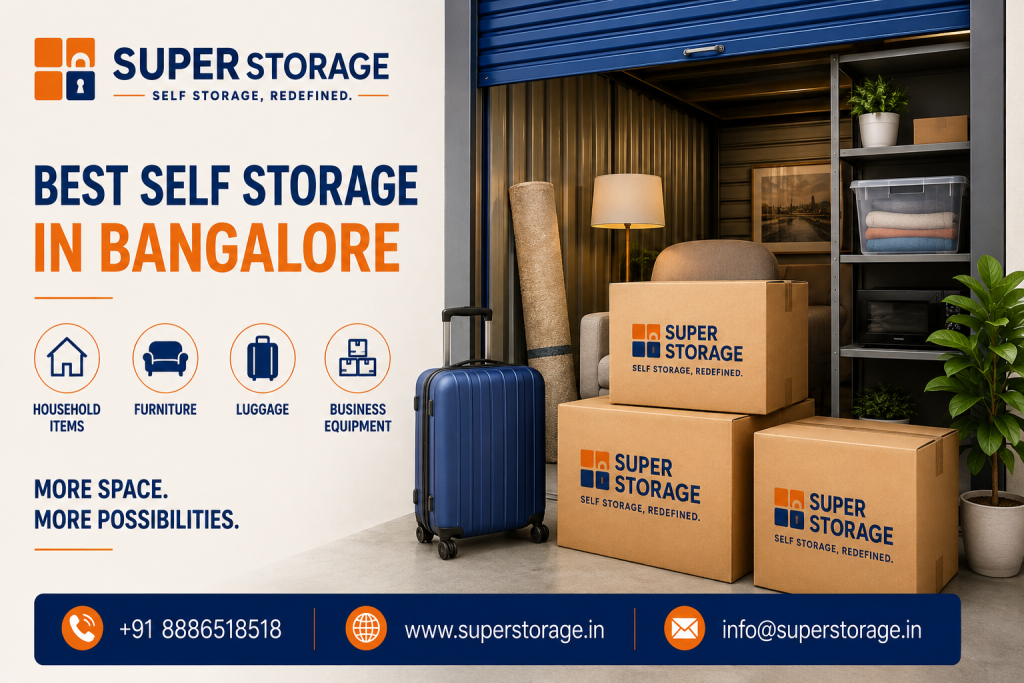 A promotional banner for Super Storage highlighting premium self-storage solutions in Bangalore, displaying an open self-storage garage unit with a blue roll-up door containing a comfortable armchair, floor lamp, rolled carpet, and metal shelving with home decor and storage bins, while in the foreground sits a blue rolling suitcase alongside stacked Super Storage cardboard boxes, accompanied by the headline "Best Self Storage In Bangalore: More Space. More Possibilities.", feature icons for "Household Items", "Furniture", "Luggage", and "Business Equipment", and Super Storage contact details at the bottom.